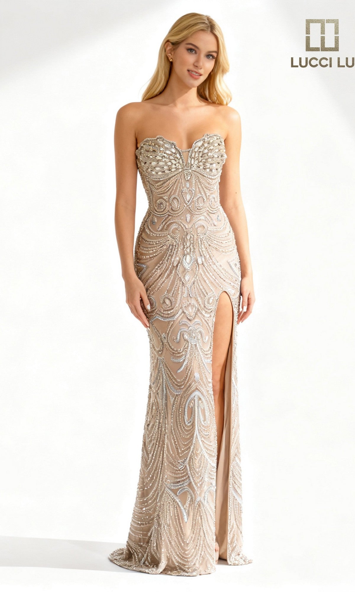 A woman models the Lucci Lu 92149 long prom dress—a nude, strapless, beaded sheath gown with silver accents and a high slit—against a simple light backdrop. The